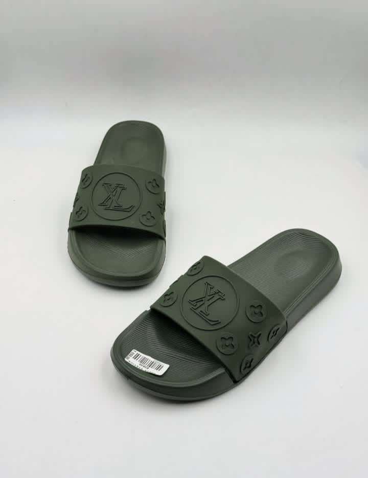 Louis Vuitton Waterfront Mule slides, featuring an embossed Monogram pattern on flexible rubber.
